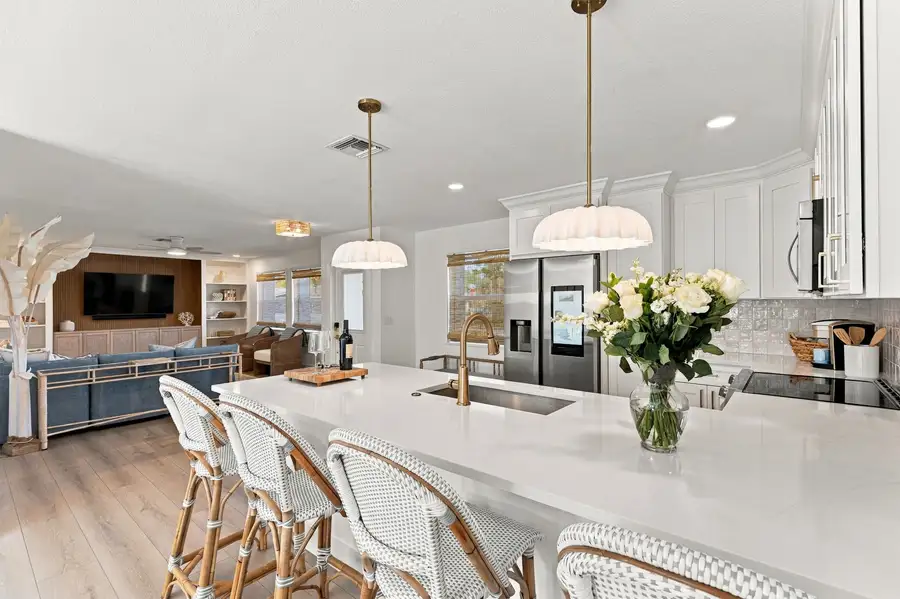 Renovated white kitchen with breakfast bar